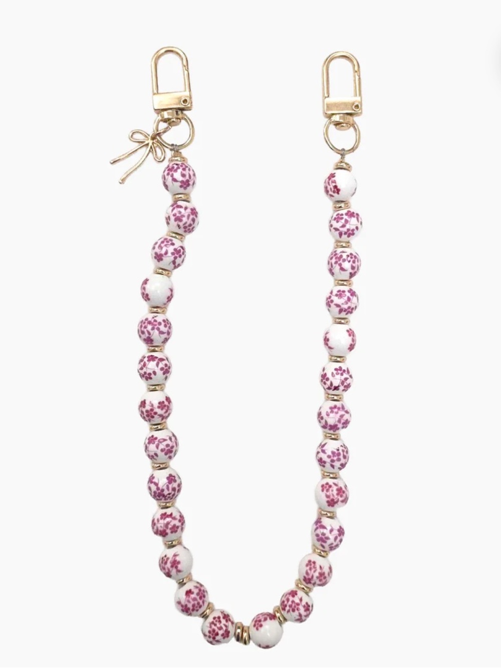 ARTIKL CHINOISERIE BEADS & BOW WRISTLET PHONE STRAP PINK buckle designer